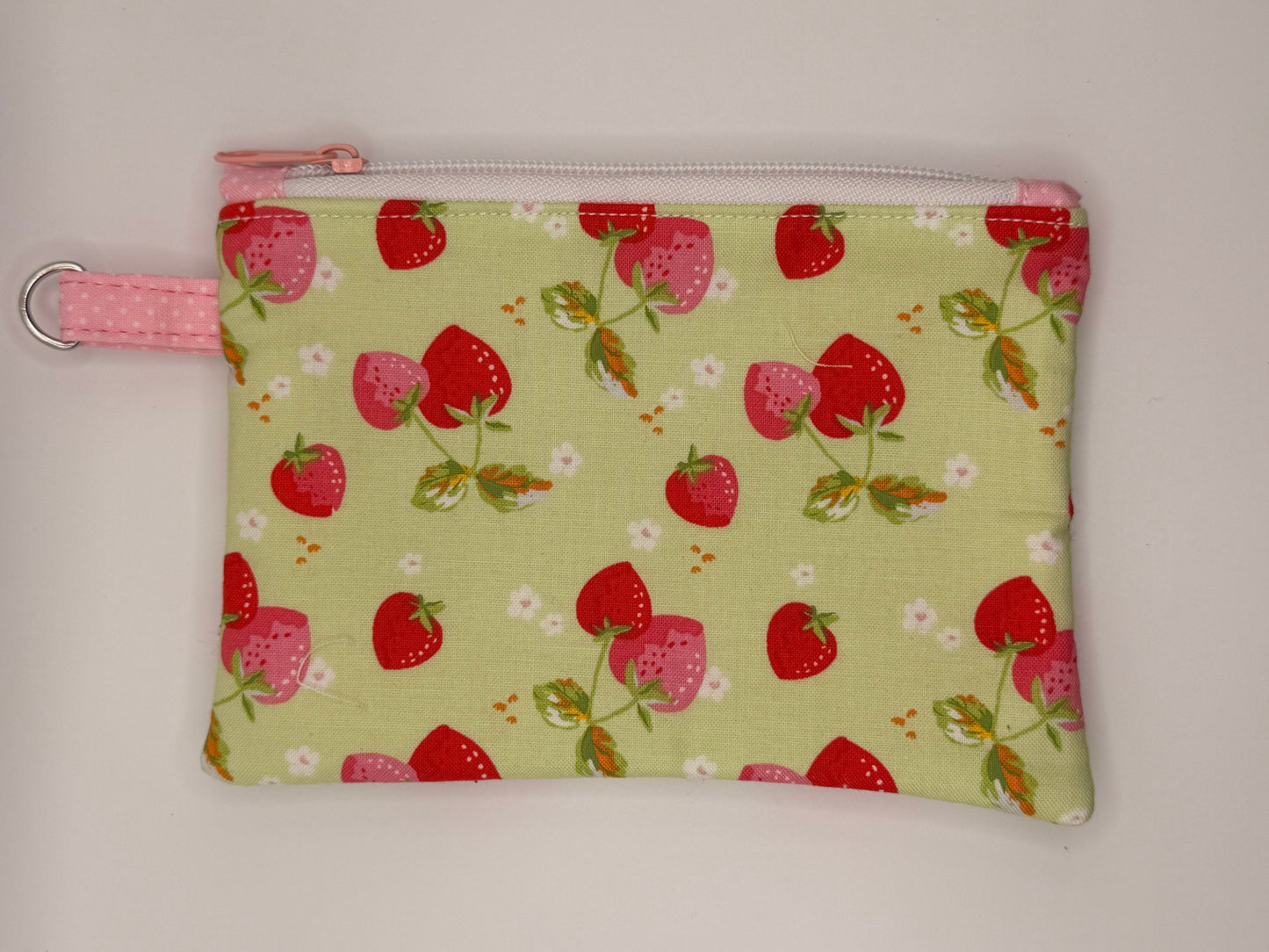 Strawberries and white flowers on green zipper wallet